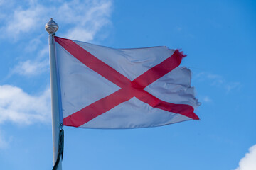 England St George Red Cross on White Background Flag flying in breeze showing fibres and movement