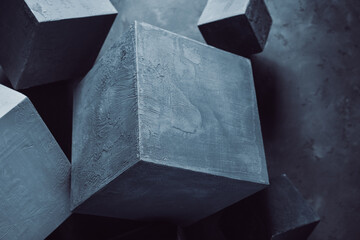 Cement blocks near wall background construction concept. Concrete cube shape abstract art idea