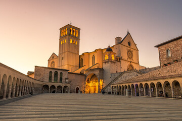 ASSISI, ITALY, 6 AUGUST 2021 Sunset over the San Francesco Basilica, one of the most important...