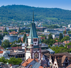 View from Freiburg Minster tower (Cathedral of Our Lady) over Freiburg to old Martin Gate tower....