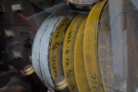 Old Film Canisters On Shelf