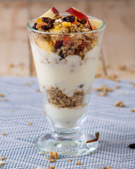 Cup of Parfait made of granola and fruits