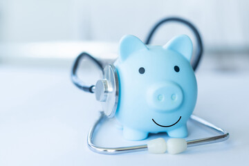 Piggy Bank and Stethoscope Isolated on a White Background.