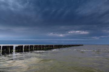 Fototapeta na wymiar Sea gulls and old fishing boat pier at Jurmalciems, Latvia.