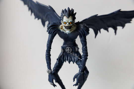 Russia Saint Petersburg 02.07.2022 Figurine of the god of death Ryuk on a gray background. Character anime DEATH NOTE