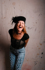 woman in black feathered hat with happy smile