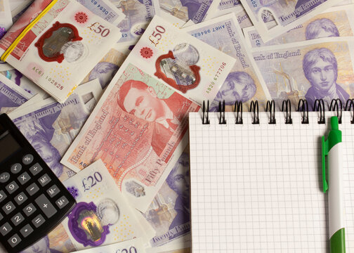 british money and calculator, notepad