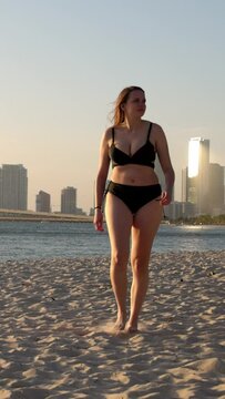 Young woman wearing a bikini at the beach on sunset over Miami - travel photography