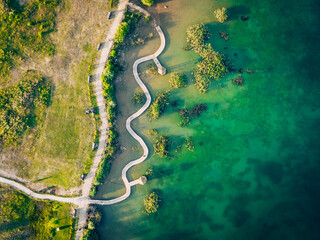 Turquiose Water and Wooden Bridge. Aerial Landscape. Park Grodek in Jaworzno, Poland. Polish Maldives.
