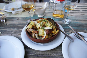 Georgian national dish ojahuri with meat on wooden background