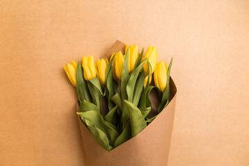 Tulips bouquet yellow on a light background