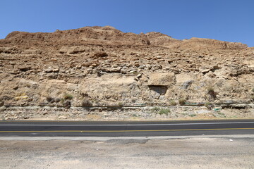 Road in the Eilat mountains in the Negev desert - obrazy, fototapety, plakaty