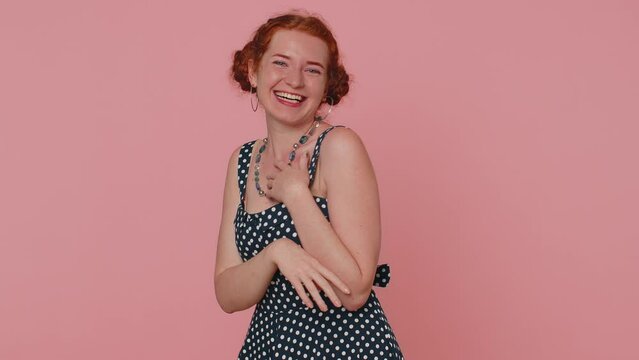 Happy young woman laughing out loud after hearing ridiculous anecdote, funny joke, feeling carefree amused, positive people lifestyle. Ginger freckles girl isolated alone on pink studio background