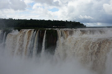 The photo shows a stunning view from the top of the Iguazu Falls — a complex of 275 waterfalls on the Iguazu River, located on the border of Brazil and Argentina