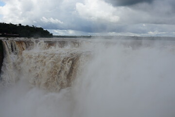 The photo shows a stunning view from the top of the Iguazu Falls — a complex of 275 waterfalls on the Iguazu River, located on the border of Brazil and Argentina