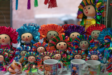 A group of colorful Mexican Marias dolls