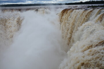 The photo shows a stunning view from the top of the Iguazu Falls — a complex of 275 waterfalls on the Iguazu River, located on the border of Brazil and Argentina