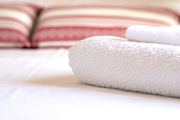 Beautifully folded white towels in a luxury bedroom in a hotel
