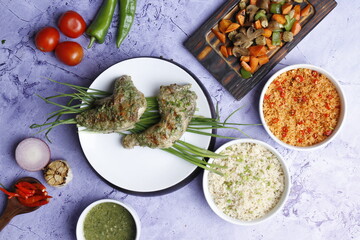 Barbecue chicken wings close up on wooden tray, shot with selective focus