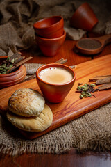 Coffee cups milk beans and ground coffee in jar on wooden background high quality photo