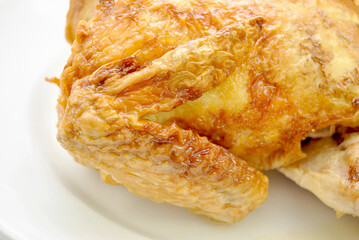 Close-up of a Chicken Wing on a Whole Chicken