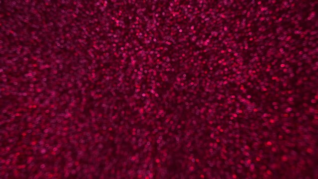 Pink and red blurry sparkling glitter bokeh bg texture background