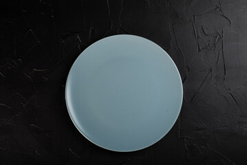 Gray empty plate on black background
