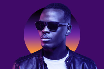 Neon portrait of african man in shades and black leather jacket isolated on purple