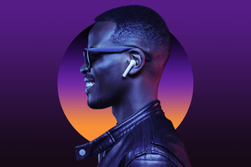 Neon profile portrait of black man in shades and earphones listening to music