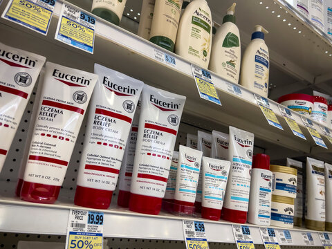 Seattle, WA USA - circa May 2022: Close up view of Eucerin body lotions for sale inside a Rite Aid Pharmacy.
