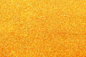 Shiny gold sparkles glitter background for new year, Christmas, wedding design of invitations and postcards with copy space