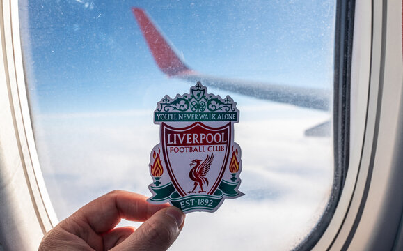 December 6, 2021. Liverpool, United Kingdom. The emblem of the Liverpool F.C. football club on the background of an airplane window.
