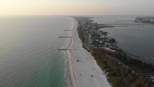 Aerial view from a drone flying over Anna Maria island in Florida with beach real estate property