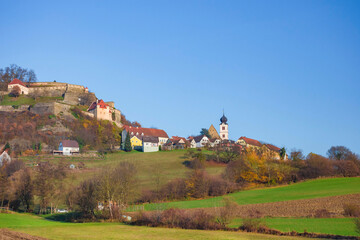 Fototapeta na wymiar The medieval Riegersburg Castle on top of a dormant volcano, surrounded by charming little village and beautiful autumn landscape, famous tourist attraction in Styria region, Austria