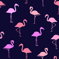 Seamless tile wallpaper of pink flamingo silhouettes against a dark    blue background