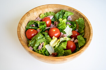 Healthy and tasty salad in a bamboo bowl