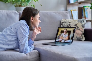 Online therapy meeting of young woman with psychologist