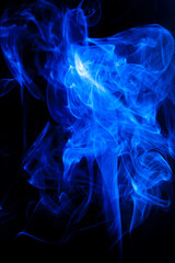 Blue smoke motion on black background.
