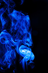Blue smoke motion on black background.