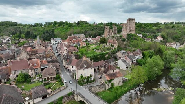 Aerial view of the ruins of Herisson fortress of the Dukes of Bourbon dominate the medieval city of H&eacute;risson and Aumance Valley with towers standing tall in the inner castle in central France