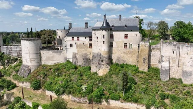 Aerial view of the royal lodgings in the middle castle of Chinon with adjoining curtain walls restored recently with blue cloudy summer sky