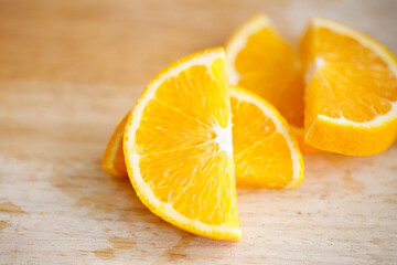 Slice of orange fruit on wooden background