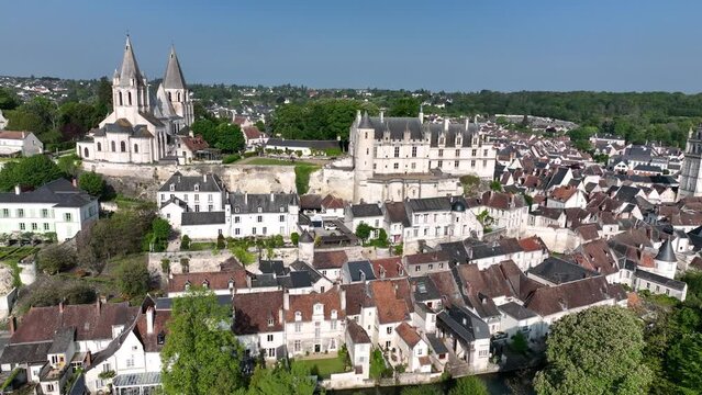 Flying along the medieval city walls of Loches, Loire Valley France, with Renaissance Royal Palace, Gatehouse, semi circular towers, double enclosure, donjon, Gotchic church