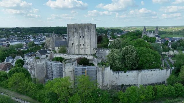 Panning shot around the Royal Donjon of Loches Loire Valley France, feudal medieval stronghold on a sunny spring day with scaffolding used to restore the walls