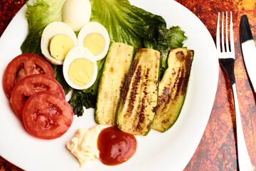 Boiled egg with combined vegetables such as pumpkin, Chinese lettuce, tomato to prepare them with ketchup and mayonnaise sauce