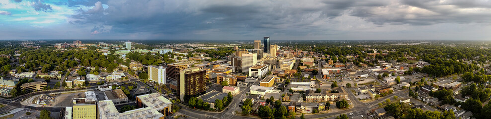 Fototapeta na wymiar Aerial panorama of downtown Lexington, KY during early morning sunrise. Local University of Kentucky visible in a distance.
