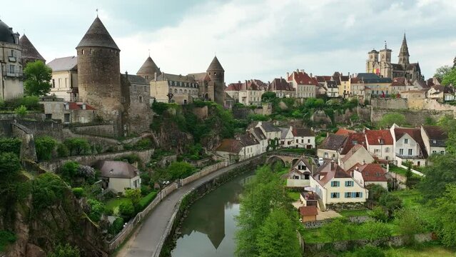 Aerial view of Semur en Auxois in Burgundy with medieval city perched on a rock above the river, four tower castle, one of the most beautiful small towns in France