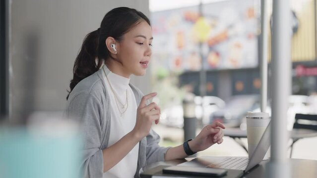 Future of workforce work hybrid anywhere workplace for Gen Z talent. Young adult asia people sit relax video call talk online telework or study MBA class at coffee shop cafes. Happy digital nomad job.