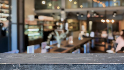 Empty black marble stone table top and blurred coffee shop, cafe and restaurant interior background...