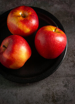 Apples in a dramatic low key concept with a dark background in variety angles for multipurpose